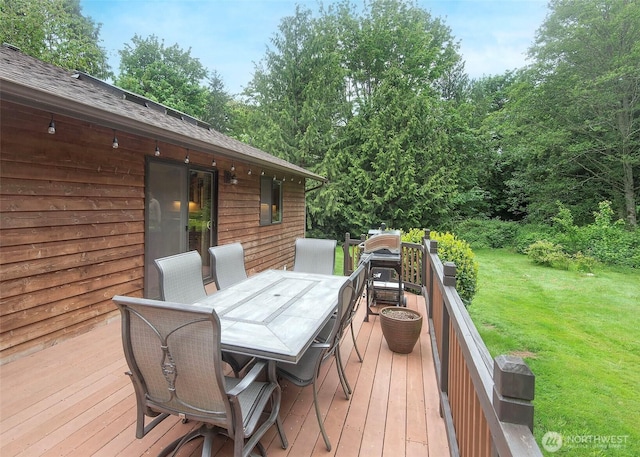 5707 316th St NW, Stanwood, WA 98292 - wooden terrace with outdoor dining area and a yard