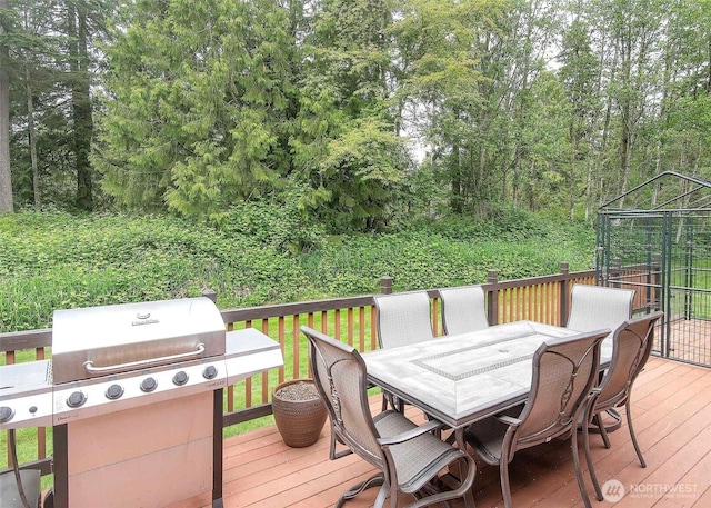 5707 316th St NW, Stanwood, WA 98292 - wooden deck featuring outdoor dining space and area for grilling
