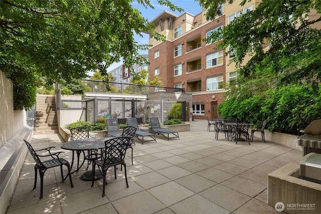 5450 Leary Ave NW Unit 442, Seattle, WA 98107 - view of patio with stairway and outdoor dining area