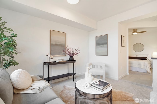 5450 Leary Ave NW Unit 442, Seattle, WA 98107 - carpeted living room featuring ceiling fan and baseboards