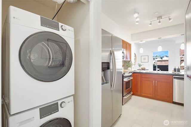 5450 Leary Ave NW Unit 442, Seattle, WA 98107 - laundry room featuring stacked washer / dryer