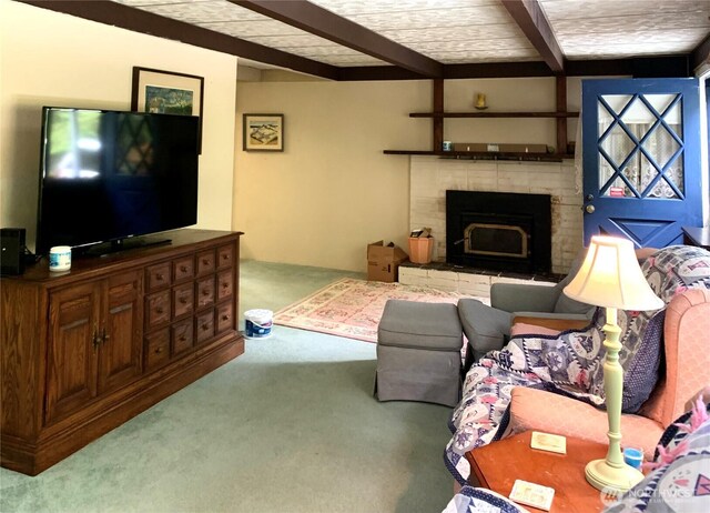419 Draconis Ave SE, Ocean Shores, WA 98569 - living room with carpet, beamed ceiling, and a fireplace