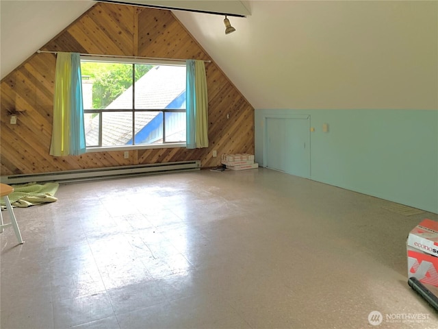 419 Draconis Ave SE, Ocean Shores, WA 98569 - bonus room featuring wood walls, vaulted ceiling, baseboard heating, and tile patterned floors