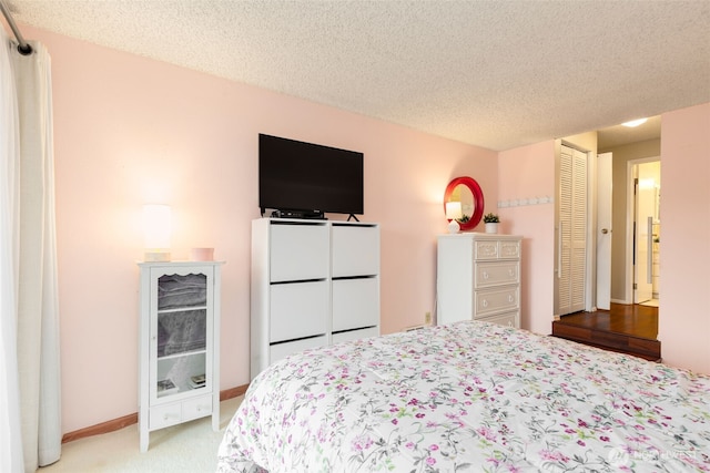 3661 24th Pl W Unit 104, Seattle, WA 98199 - bedroom with light colored carpet and a textured ceiling