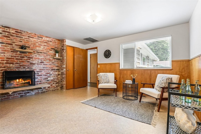 20010 3rd Ave NW, Shoreline, WA 98177 - sitting room featuring wainscoting, wooden walls, and a fireplace