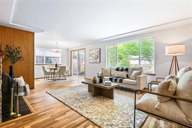 20010 3rd Ave NW, Shoreline, WA 98177 - living area with healthy amount of natural light, light wood-style floors, and a chandelier