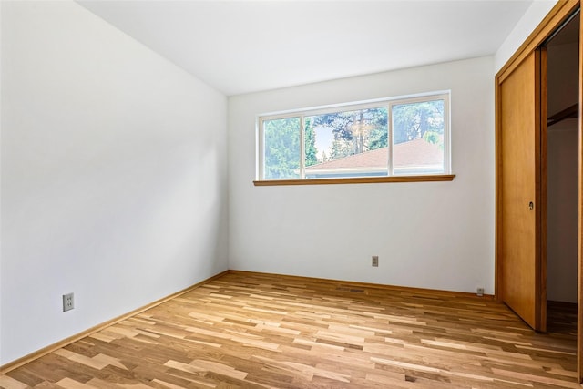 20010 3rd Ave NW, Shoreline, WA 98177 - unfurnished bedroom with light wood finished floors and a closet