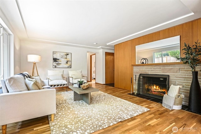 20010 3rd Ave NW, Shoreline, WA 98177 - living room with a stone fireplace, wood finished floors, and a raised ceiling