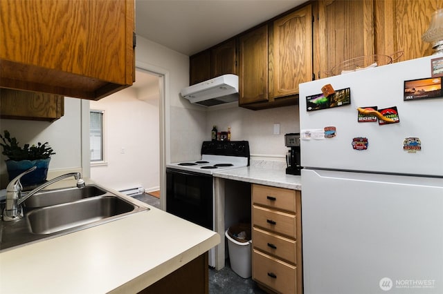 1601 E Maryland St, Bellingham, WA 98226 - kitchen with freestanding refrigerator, electric range oven, under cabinet range hood, a sink, and light countertops