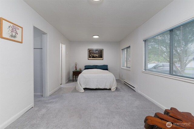 1601 E Maryland St, Bellingham, WA 98226 - bedroom with baseboard heating, carpet, and baseboards