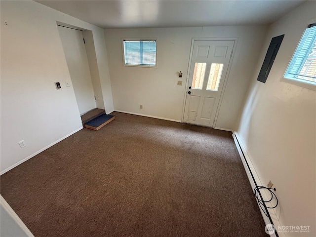 1601 E Maryland St, Bellingham, WA 98226 - entrance foyer featuring a baseboard heating unit and dark carpet