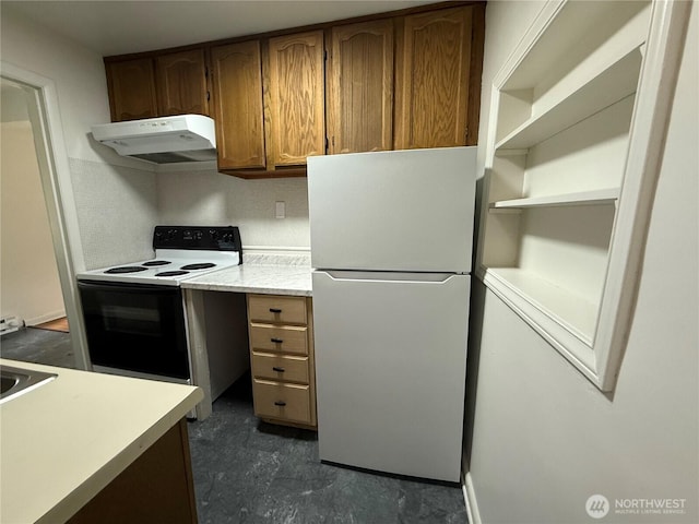 1601 E Maryland St, Bellingham, WA 98226 - kitchen featuring freestanding refrigerator, electric range oven, under cabinet range hood, light countertops, and brown cabinetry