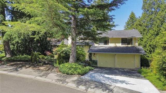 5911 105th Ave NE, Kirkland, WA 98033 - view of front facade featuring a garage, driveway, and a shingled roof