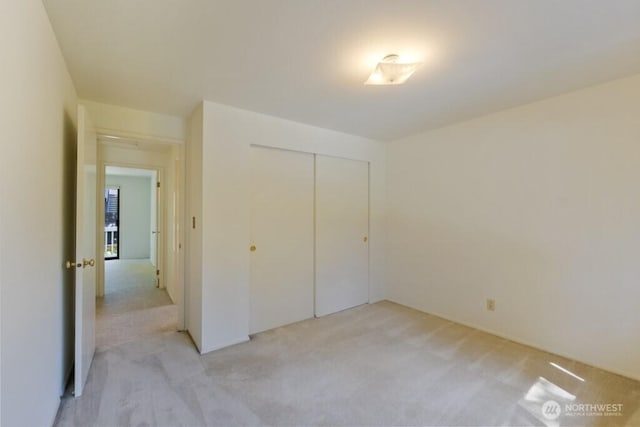 5911 105th Ave NE, Kirkland, WA 98033 - unfurnished bedroom featuring light carpet and a closet