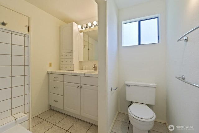 5911 105th Ave NE, Kirkland, WA 98033 - full bath featuring vanity, toilet, tile patterned floors, and baseboards