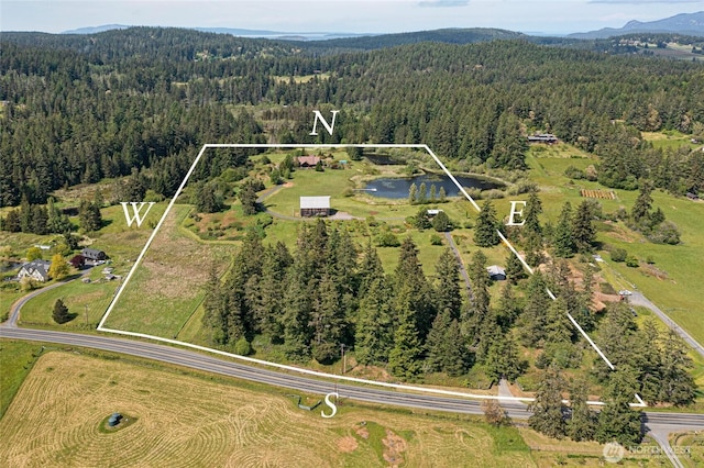 3528 Beaverton Valley Rd, Friday Harbor, WA 98250 - view of property location with a heavily wooded area, property boundaries highlighted, and a water and mountain view