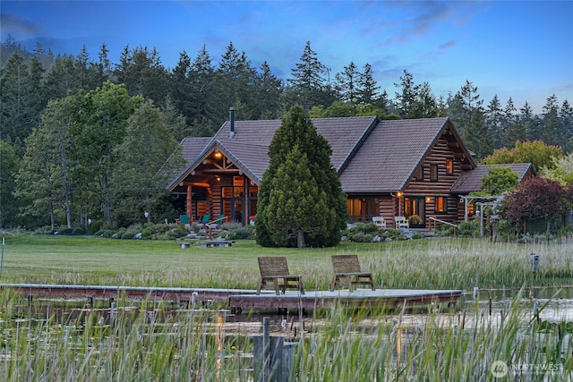3528 Beaverton Valley Rd, Friday Harbor, WA 98250 - log home featuring log exterior, a wooded view, and a tile roof