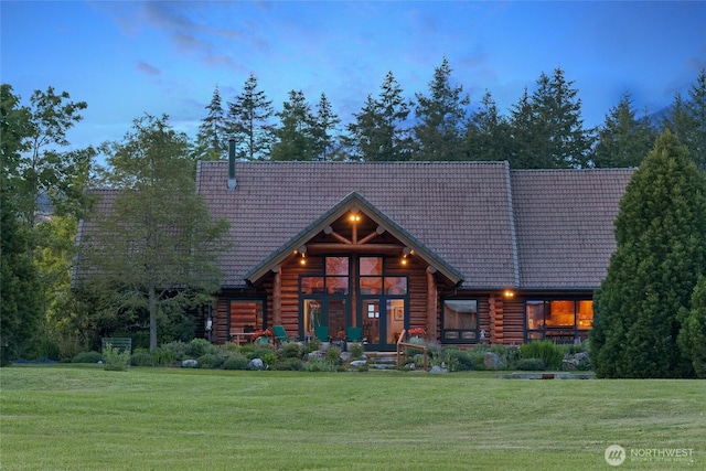 3528 Beaverton Valley Rd, Friday Harbor, WA 98250 - rear view of house featuring a lawn, a tile roof, and log siding