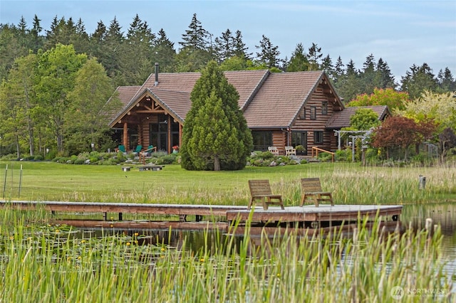 3528 Beaverton Valley Rd, Friday Harbor, WA 98250 - rear view of house with log siding, a tile roof, a lawn, and a water view