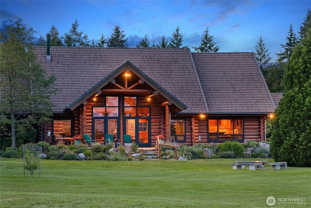 3528 Beaverton Valley Rd, Friday Harbor, WA 98250 - back of property with a tile roof, log siding, and a yard