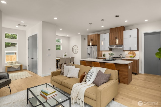 2727 50th Ave SW, Seattle, WA 98116 - living area featuring light wood-style flooring, recessed lighting, and baseboards