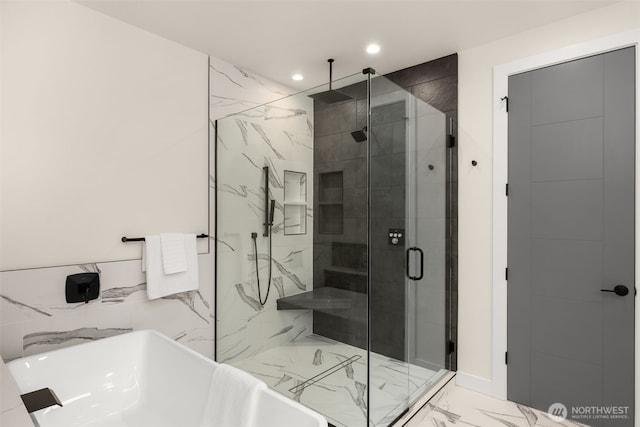 2727 50th Ave SW, Seattle, WA 98116 - bathroom with marble look tile flooring, a stall shower, recessed lighting, and a freestanding tub