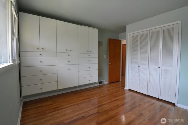 2116 N 86th St, Seattle, WA 98103 - unfurnished bedroom with wood finished floors and a closet
