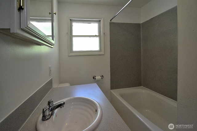 2116 N 86th St, Seattle, WA 98103 - bathroom with a sink and  shower combination