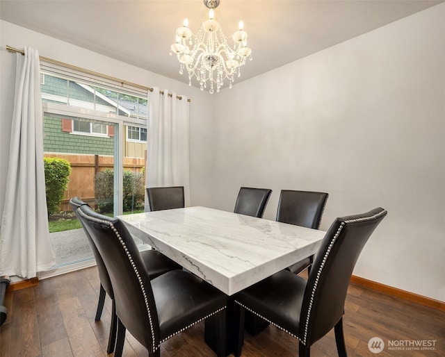 18526 36th Ave W Unit C, Lynnwood, WA 98037 - dining area featuring a chandelier, dark wood-style flooring, and baseboards