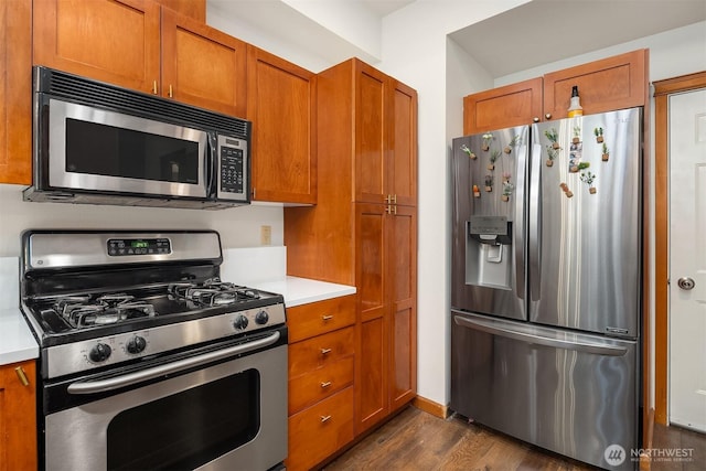 18526 36th Ave W Unit C, Lynnwood, WA 98037 - kitchen with appliances with stainless steel finishes, light countertops, and brown cabinets