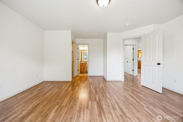 301 SE 4th Ave, Battle Ground, WA 98604 - unfurnished bedroom with light wood-style floors and baseboards
