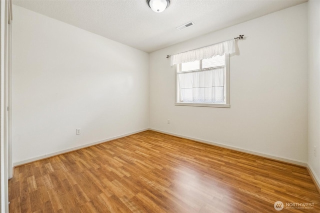 301 SE 4th Ave, Battle Ground, WA 98604 - spare room with wood finished floors and baseboards