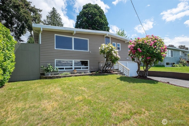 25718 16th Ave S, Des Moines, WA 98198 - view of front of home with a front lawn, a garage, and driveway