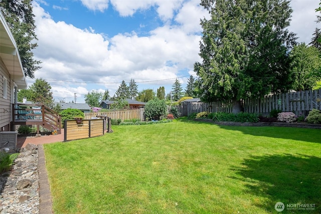 25718 16th Ave S, Des Moines, WA 98198 - view of yard featuring central AC and a deck
