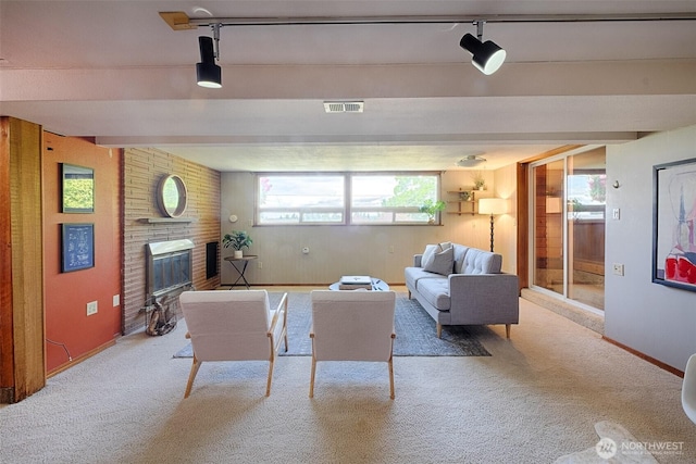 25718 16th Ave S, Des Moines, WA 98198 - carpeted living room with a brick fireplace, baseboards, and wood walls