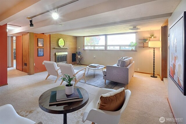 25718 16th Ave S, Des Moines, WA 98198 - carpeted living area featuring a brick fireplace