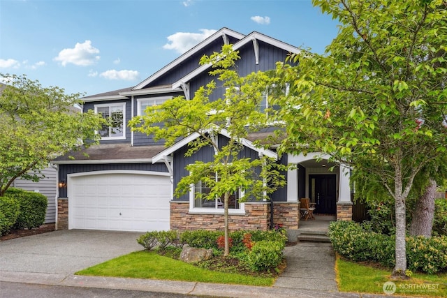 27309 SE 10th Ct, Sammamish, WA 98075 - craftsman house featuring board and batten siding, stone siding, driveway, and an attached garage