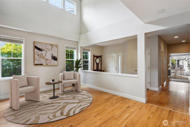 27309 SE 10th Ct, Sammamish, WA 98075 - living area featuring light wood-style floors, baseboards, and recessed lighting