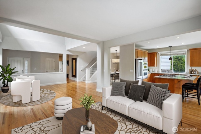 27309 SE 10th Ct, Sammamish, WA 98075 - living area with light wood-style flooring, stairs, baseboards, and recessed lighting