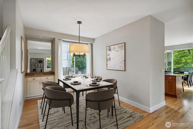 27309 SE 10th Ct, Sammamish, WA 98075 - dining area with light wood-style flooring and baseboards