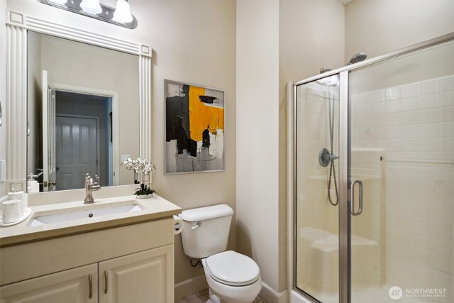 27309 SE 10th Ct, Sammamish, WA 98075 - bathroom with a stall shower, vanity, toilet, and baseboards