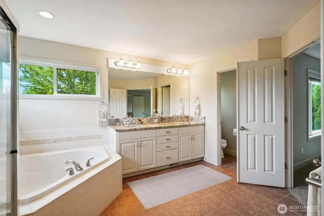 27309 SE 10th Ct, Sammamish, WA 98075 - full bath featuring double vanity, tile patterned flooring, a garden tub, and healthy amount of natural light