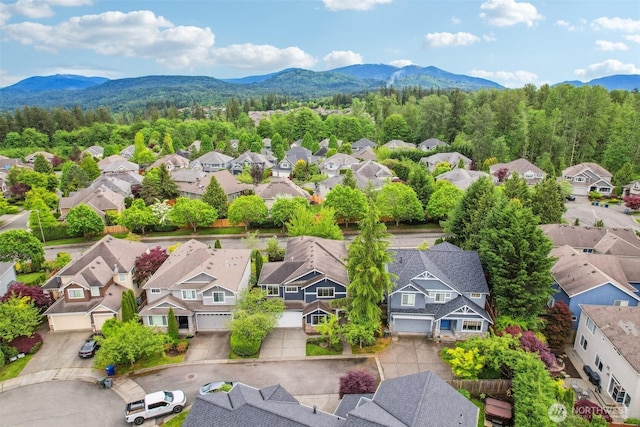 27309 SE 10th Ct, Sammamish, WA 98075 - aerial perspective of suburban area featuring a mountainous background and a forest