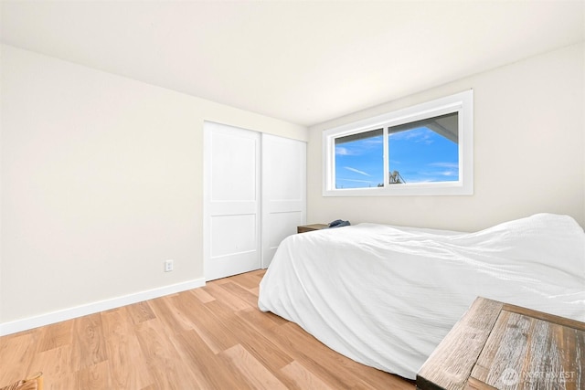 1005 Johnson St, Sumas, WA 98295 - bedroom featuring light wood-style flooring, a closet, and baseboards