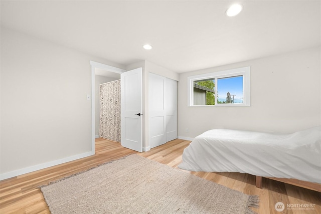 1005 Johnson St, Sumas, WA 98295 - bedroom with baseboards, wood finished floors, recessed lighting, and a closet