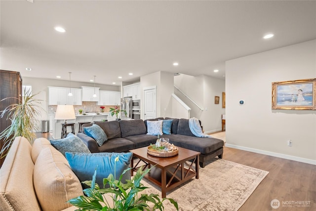 1009 NE 13th St, Battle Ground, WA 98604 - living room with light wood-style flooring, recessed lighting, stairs, and baseboards