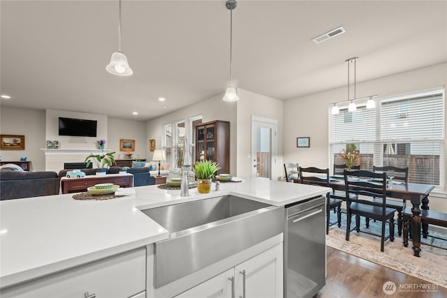 1009 NE 13th St, Battle Ground, WA 98604 - kitchen featuring stainless steel dishwasher, light countertops, decorative light fixtures, and recessed lighting