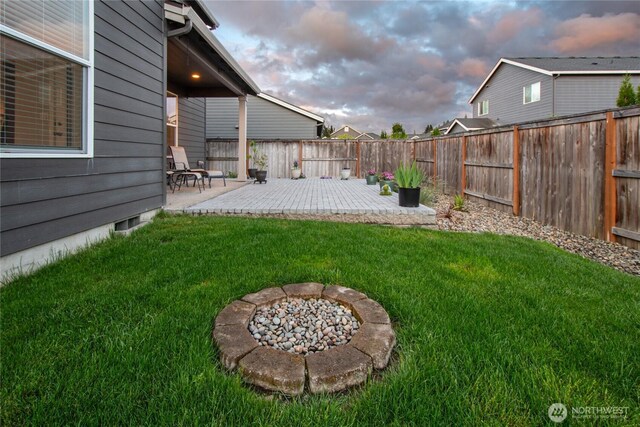 1009 NE 13th St, Battle Ground, WA 98604 - yard at dusk featuring a patio area and an outdoor fire pit