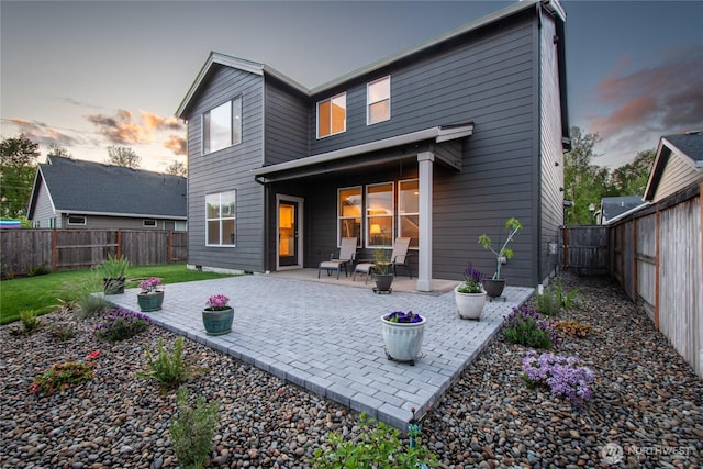 1009 NE 13th St, Battle Ground, WA 98604 - back of house featuring a fenced backyard and a patio