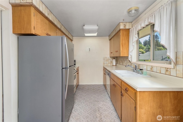 2815 NE Wyoming St, Bremerton, WA 98310 - kitchen with freestanding refrigerator, dishwasher, light countertops, a sink, and decorative backsplash